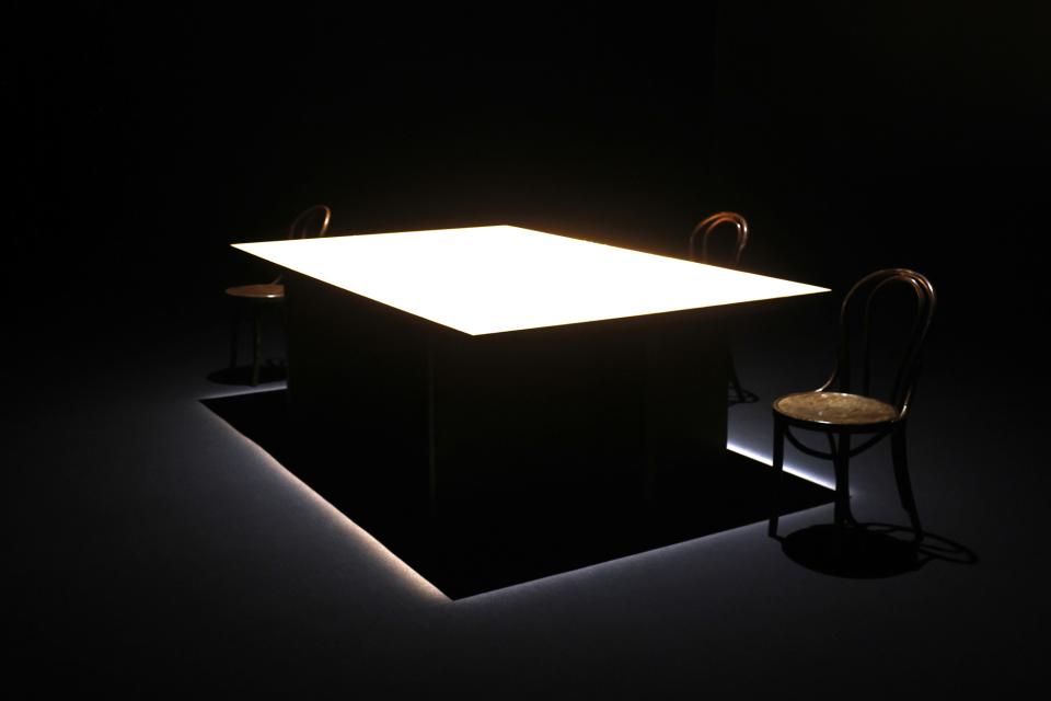 A big table with one chair