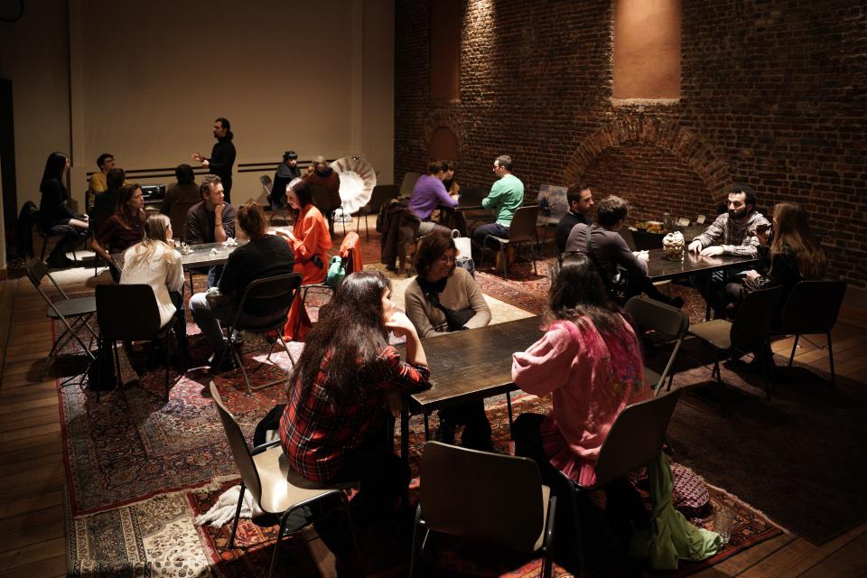 People sitting around tables