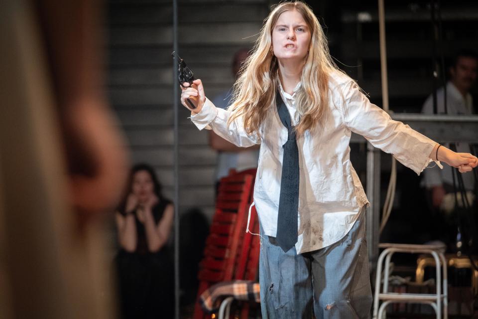 An actor angrily brandishing an old-timey pistol